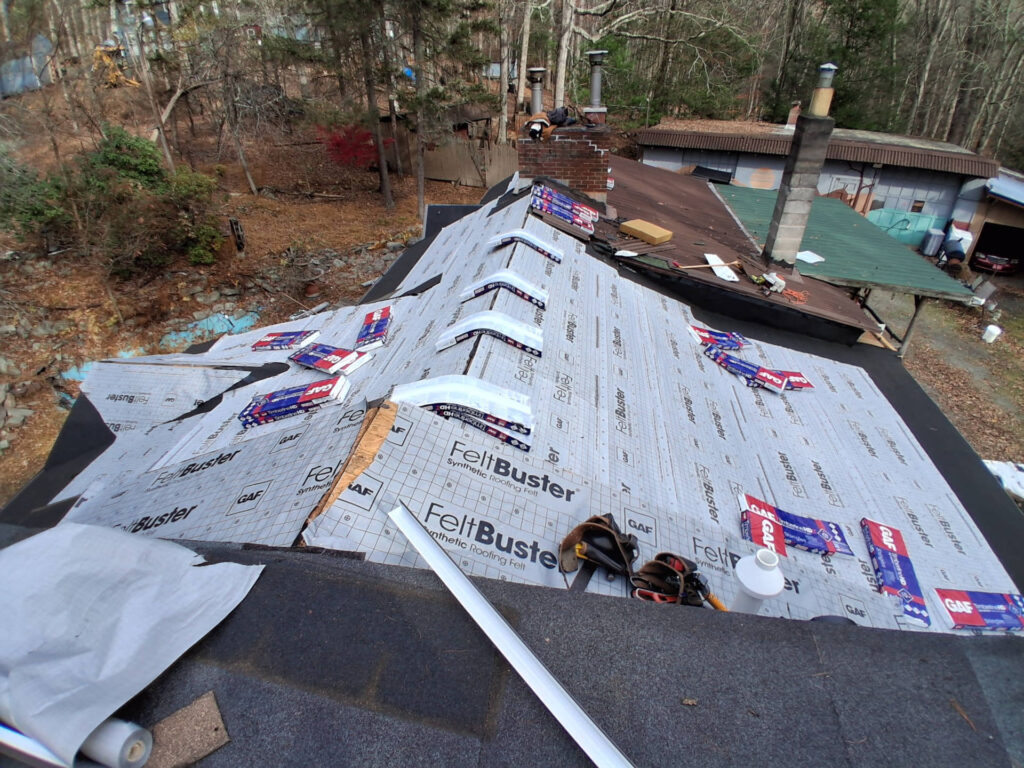 Roof replacement construction - shingles on roof ready for install